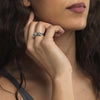 sterling silver bow finger ring displayed on model