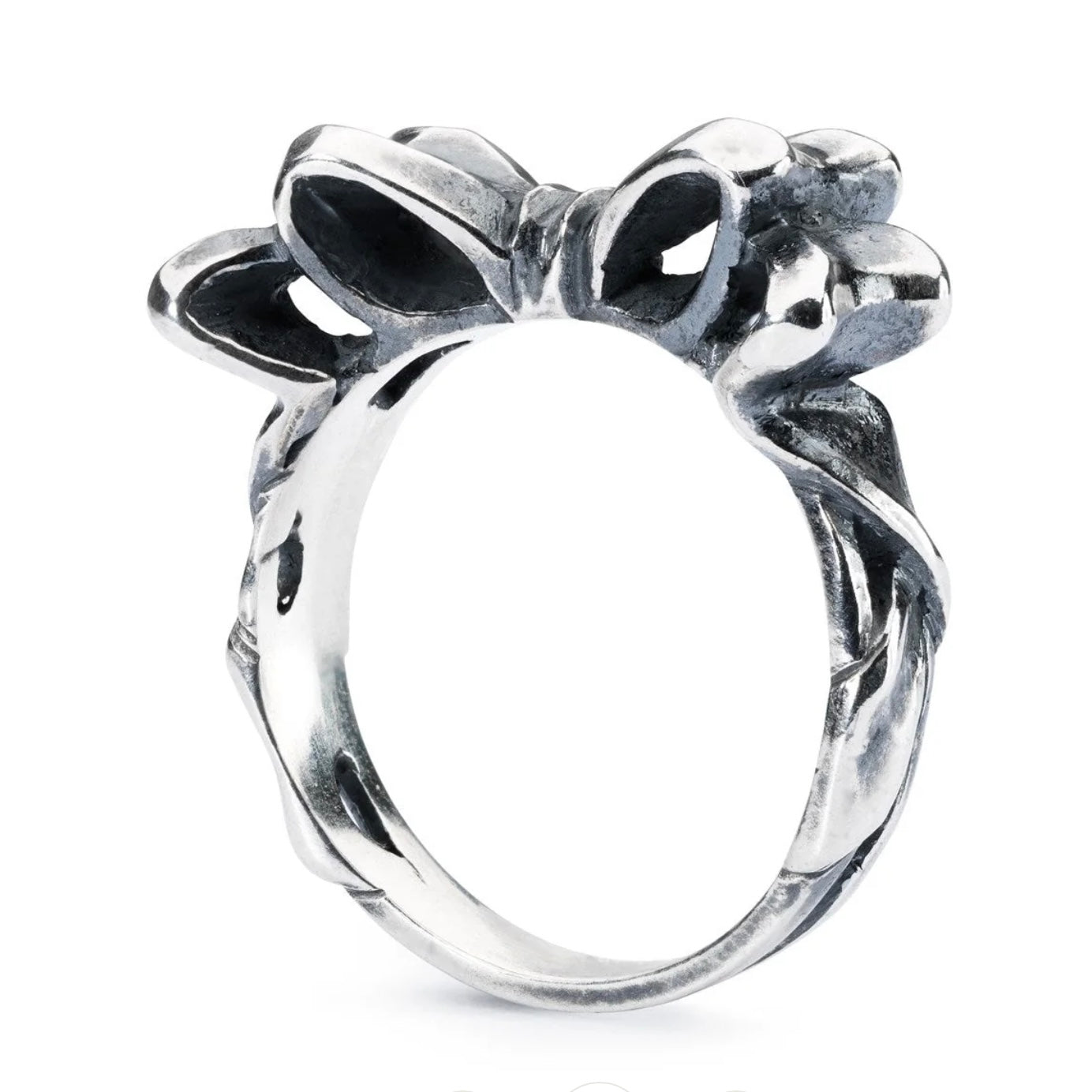 Silver ring with bow design on a white background
